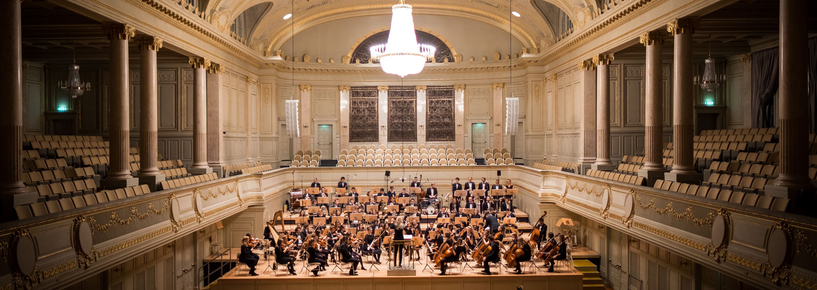 Picture of a concert hall with an orchestra inside